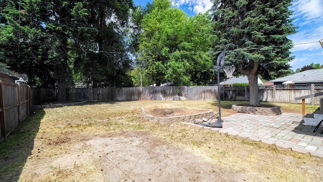 6121 N Belt St, Spokane, WA 99205 - fenced backyard featuring a patio area