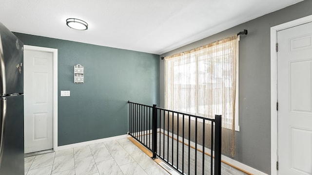 6121 N Belt St, Spokane, WA 99205 - corridor featuring an upstairs landing and marble look tile flooring