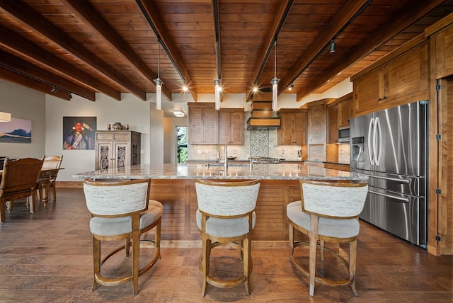 14210 N Wandermere Estates Ln, Spokane, WA 99208 - kitchen with appliances with stainless steel finishes, track lighting, a wood ceiling with exposed beams, brown cabinetry, and dark wood finished floors