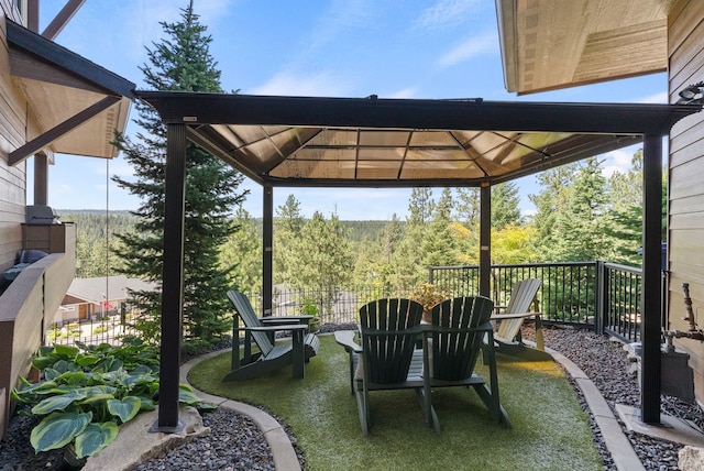 14210 N Wandermere Estates Ln, Spokane, WA 99208 - view of patio featuring a gazebo and a forest view
