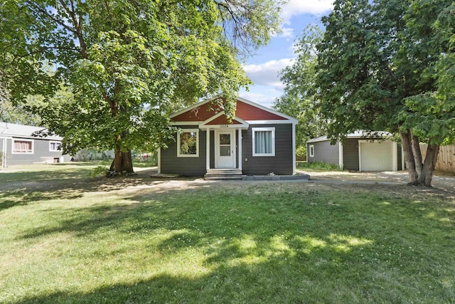 10124 N Wellen Ln, Spokane, WA 99218 - view of front facade with an outbuilding, a front yard, and a garage