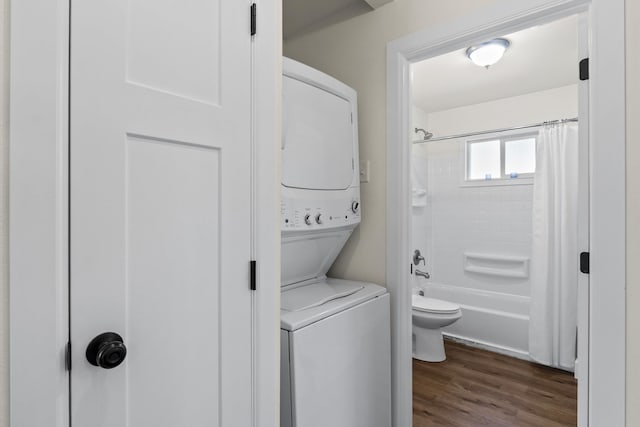 10124 N Wellen Ln, Spokane, WA 99218 - washroom featuring stacked washer / dryer and dark wood-style floors