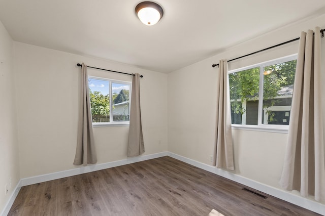 10124 N Wellen Ln, Spokane, WA 99218 - spare room with plenty of natural light and wood finished floors