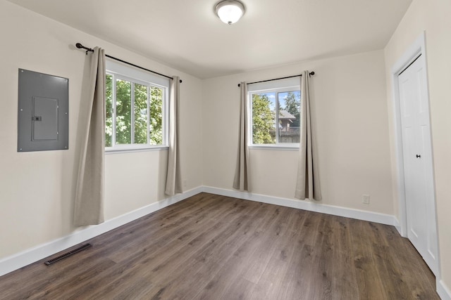 10124 N Wellen Ln, Spokane, WA 99218 - unfurnished bedroom featuring electric panel, wood finished floors, and a closet