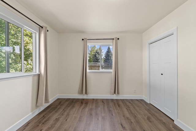 10124 N Wellen Ln, Spokane, WA 99218 - unfurnished bedroom with multiple windows and wood finished floors