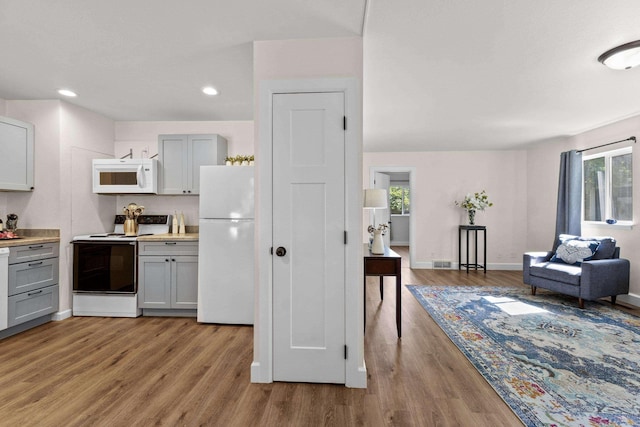 10124 N Wellen Ln, Spokane, WA 99218 - kitchen with white appliances, gray cabinets, light wood-type flooring, healthy amount of natural light, and recessed lighting