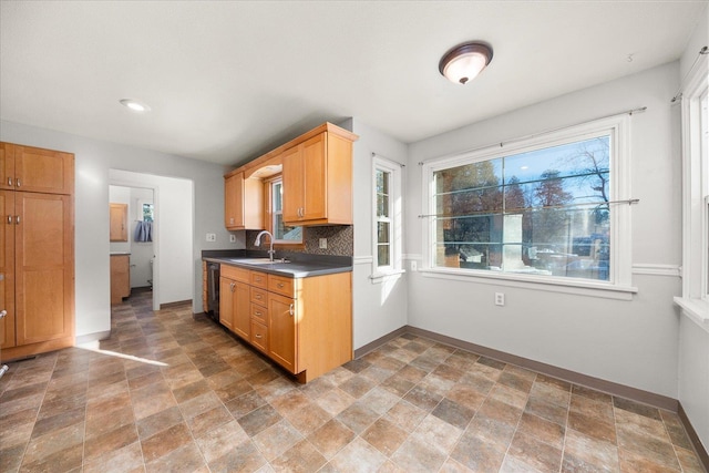 2828 S Arthur St, Spokane, WA 99203 - kitchen with stone finish floors, black dishwasher, backsplash, dark countertops, and recessed lighting