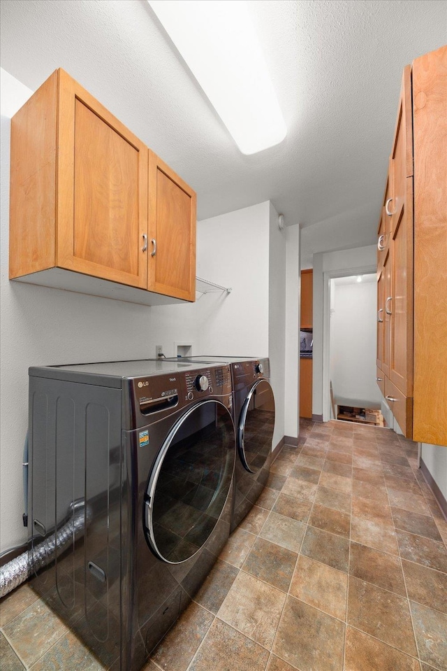 2828 S Arthur St, Spokane, WA 99203 - laundry room with cabinet space, stone finish floors, and separate washer and dryer