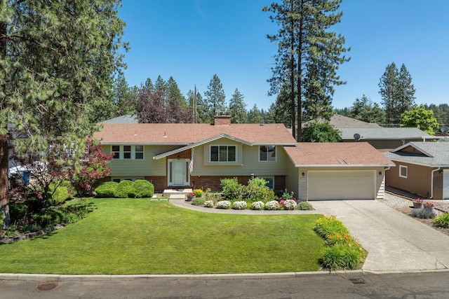 11912 N Atlantic St, Spokane, WA 99218 - split foyer home featuring an attached garage, driveway, a front lawn, and a chimney