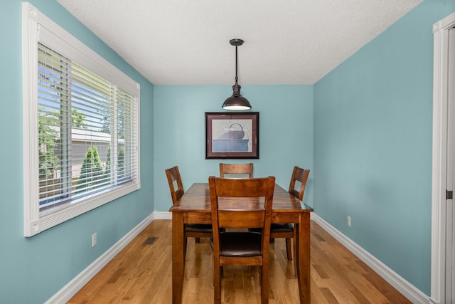 11912 N Atlantic St, Spokane, WA 99218 - dining room featuring light wood-style floors and a textured ceiling