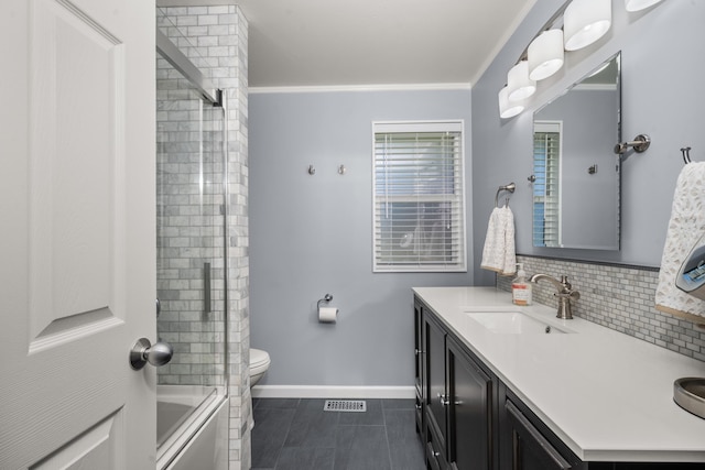 11912 N Atlantic St, Spokane, WA 99218 - bathroom with vanity, tasteful backsplash, bath / shower combo with glass door, and tile patterned floors