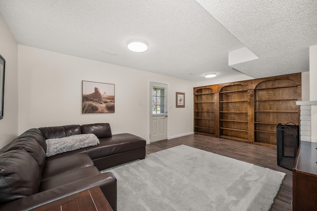 11912 N Atlantic St, Spokane, WA 99218 - living room with dark wood-style flooring and a textured ceiling