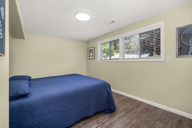 11912 N Atlantic St, Spokane, WA 99218 - bedroom with wood finished floors and a textured ceiling
