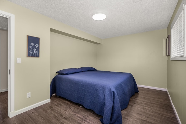 11912 N Atlantic St, Spokane, WA 99218 - bedroom with wood finished floors and a textured ceiling