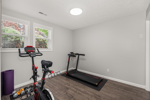 11912 N Atlantic St, Spokane, WA 99218 - exercise area featuring dark wood-style floors and a textured ceiling