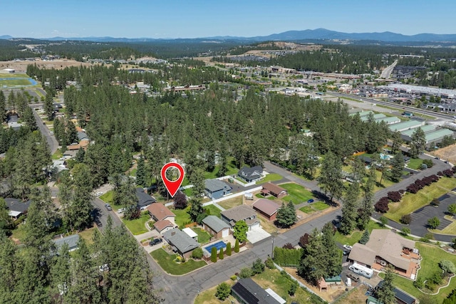 11912 N Atlantic St, Spokane, WA 99218 - aerial overview of property's location featuring a mountain backdrop