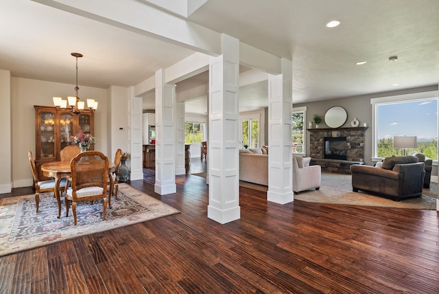 7116 S Linke Rd, Greenacres, WA 99016 - dining space with a stone fireplace, a chandelier, recessed lighting, and wood finished floors