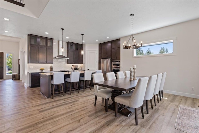 12918 E San Juan Ln, Spokane, WA 99206 - dining space featuring light wood-style flooring, recessed lighting, a chandelier, and healthy amount of natural light