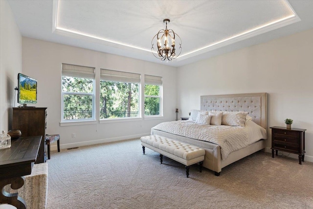 12918 E San Juan Ln, Spokane, WA 99206 - carpeted bedroom with a tray ceiling and a chandelier
