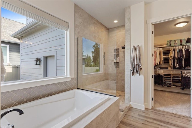 12918 E San Juan Ln, Spokane, WA 99206 - full bathroom with a bath, plenty of natural light, walk in shower, and wood finished floors