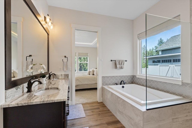12918 E San Juan Ln, Spokane, WA 99206 - full bath featuring double vanity, healthy amount of natural light, wood finished floors, and a garden tub