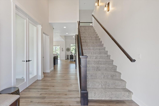 12918 E San Juan Ln, Spokane, WA 99206 - stairs featuring wood finished floors and recessed lighting