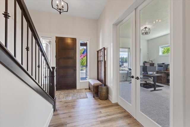 12918 E San Juan Ln, Spokane, WA 99206 - entryway featuring french doors, stairway, a chandelier, and light wood-style flooring