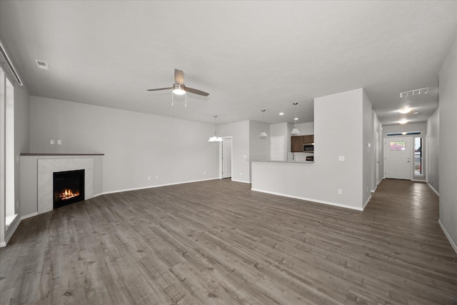 11514 E 13th Ln Unit 11516, Spokane Valley, WA 99206 - unfurnished living room featuring ceiling fan, dark wood finished floors, and a fireplace