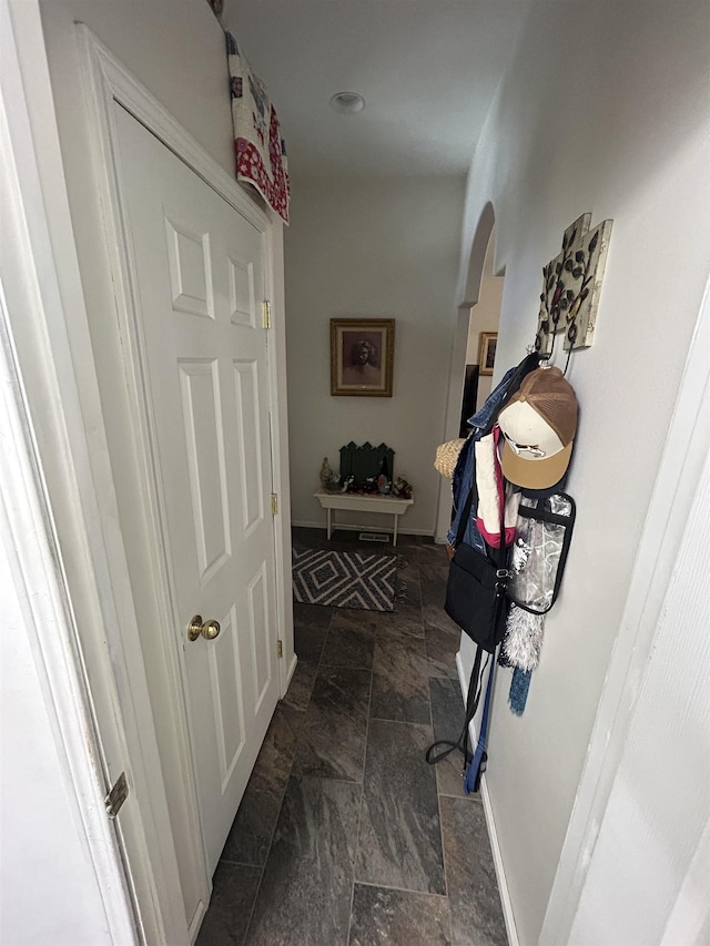 603 W Dennison-Chattaroy Rd, Deer Park, WA 99006 - hallway with dark stone finish flooring and arched walkways