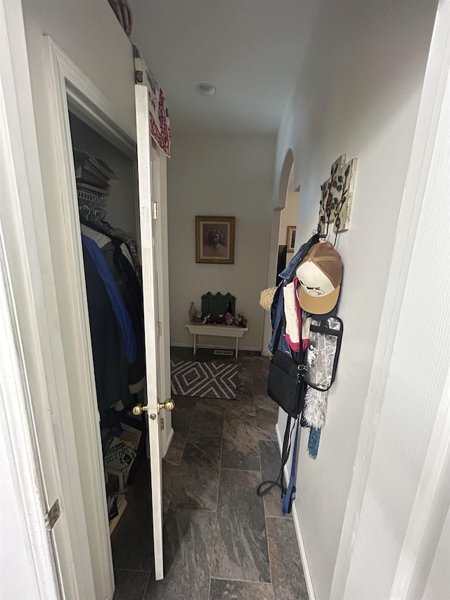 603 W Dennison-Chattaroy Rd, Deer Park, WA 99006 - hallway with arched walkways and stone finish flooring