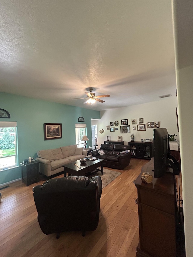 603 W Dennison-Chattaroy Rd, Deer Park, WA 99006 - living room with hardwood / wood-style flooring, ceiling fan, plenty of natural light, and a textured ceiling
