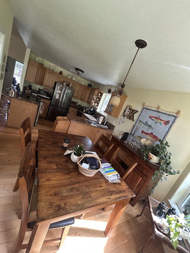 603 W Dennison-Chattaroy Rd, Deer Park, WA 99006 - dining room with wood finished floors and a textured ceiling