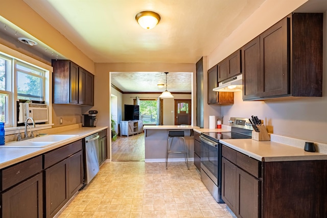 3927 N Jefferson St, Spokane, WA 99205 - kitchen featuring stainless steel appliances, under cabinet range hood, dark brown cabinets, light countertops, and ornamental molding