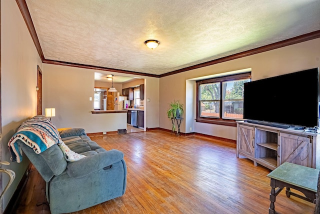 3927 N Jefferson St, Spokane, WA 99205 - living area with a textured ceiling, plenty of natural light, light wood-style flooring, and ornamental molding