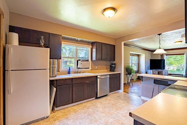 3927 N Jefferson St, Spokane, WA 99205 - kitchen featuring freestanding refrigerator, dishwasher, dark brown cabinetry, and healthy amount of natural light