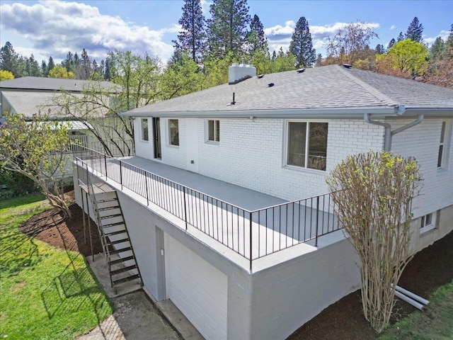 921 S Wright Blvd, Liberty Lake, WA 99019 - rear view of property featuring a chimney, roof with shingles, stairway, and brick siding