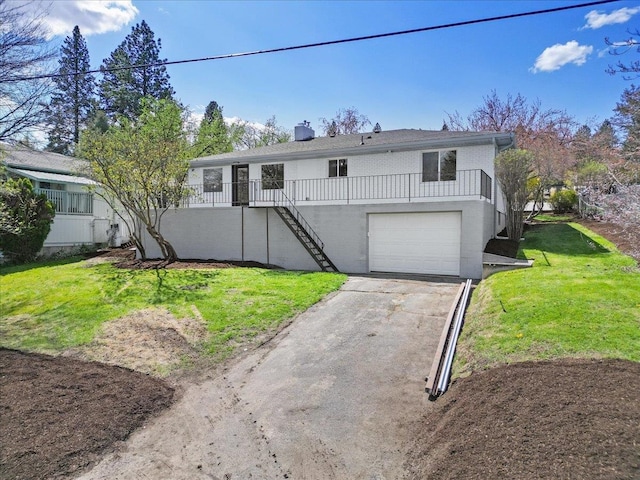 921 S Wright Blvd, Liberty Lake, WA 99019 - view of front of property with stairs, asphalt driveway, a garage, a front yard, and a chimney