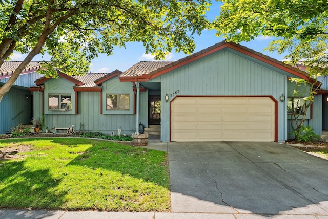 3707 S Alder Ct, Spokane, WA 99223 - view of front of home featuring a tile roof, a garage, a front lawn, and concrete driveway