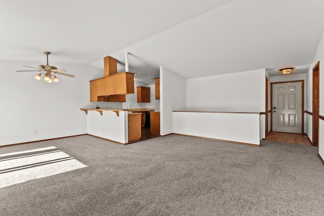 3707 S Alder Ct, Spokane, WA 99223 - unfurnished living room with carpet, vaulted ceiling, and a ceiling fan