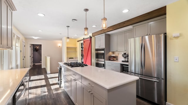 17207 N Mt Spokane Park Dr, Mead, WA 99021 - kitchen with appliances with stainless steel finishes, a barn door, gray cabinetry, recessed lighting, and dark wood-type flooring