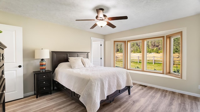 17207 N Mt Spokane Park Dr, Mead, WA 99021 - bedroom featuring light wood finished floors and ceiling fan