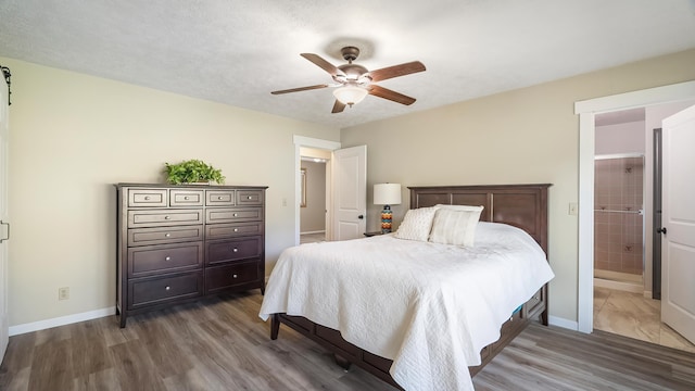 17207 N Mt Spokane Park Dr, Mead, WA 99021 - bedroom with wood finished floors, connected bathroom, and ceiling fan