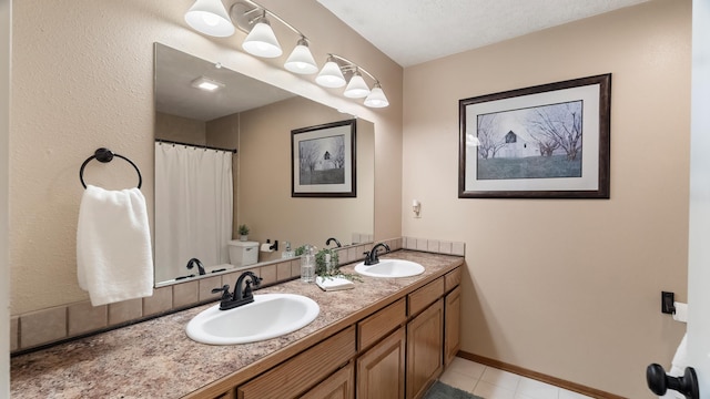 17207 N Mt Spokane Park Dr, Mead, WA 99021 - bathroom featuring double vanity, tile patterned floors, and a shower with shower curtain