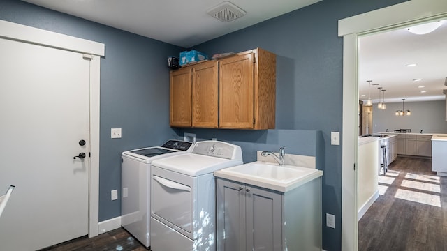 17207 N Mt Spokane Park Dr, Mead, WA 99021 - laundry room with cabinet space, separate washer and dryer, dark wood-style flooring, and recessed lighting