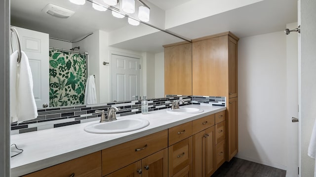 17207 N Mt Spokane Park Dr, Mead, WA 99021 - full bath featuring double vanity, tasteful backsplash, and wood finished floors