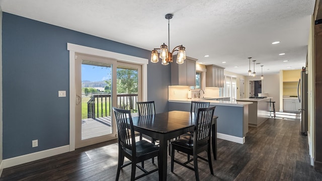 17207 N Mt Spokane Park Dr, Mead, WA 99021 - dining area with dark wood-style floors, recessed lighting, a chandelier, and a textured ceiling