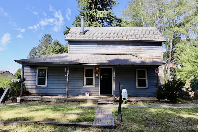 114 S Vine St, Latah, WA 99018 - view of front of property featuring covered porch, a front lawn, and roof with shingles