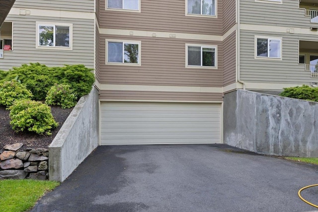 639 N Riverpoint Blvd Unit J201/J202, Spokane, WA 99202 - garage with asphalt driveway