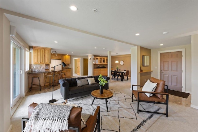 639 N Riverpoint Blvd Unit J201/J202, Spokane, WA 99202 - living area featuring light carpet and recessed lighting