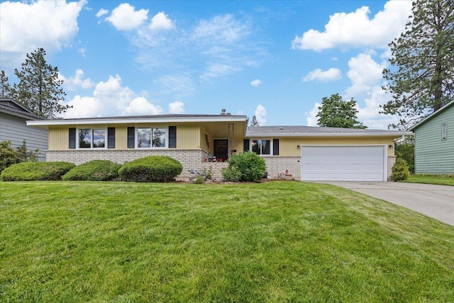2515 E 38th Ave, Spokane, WA 99223 - view of front facade featuring brick siding, an attached garage, concrete driveway, and a front lawn